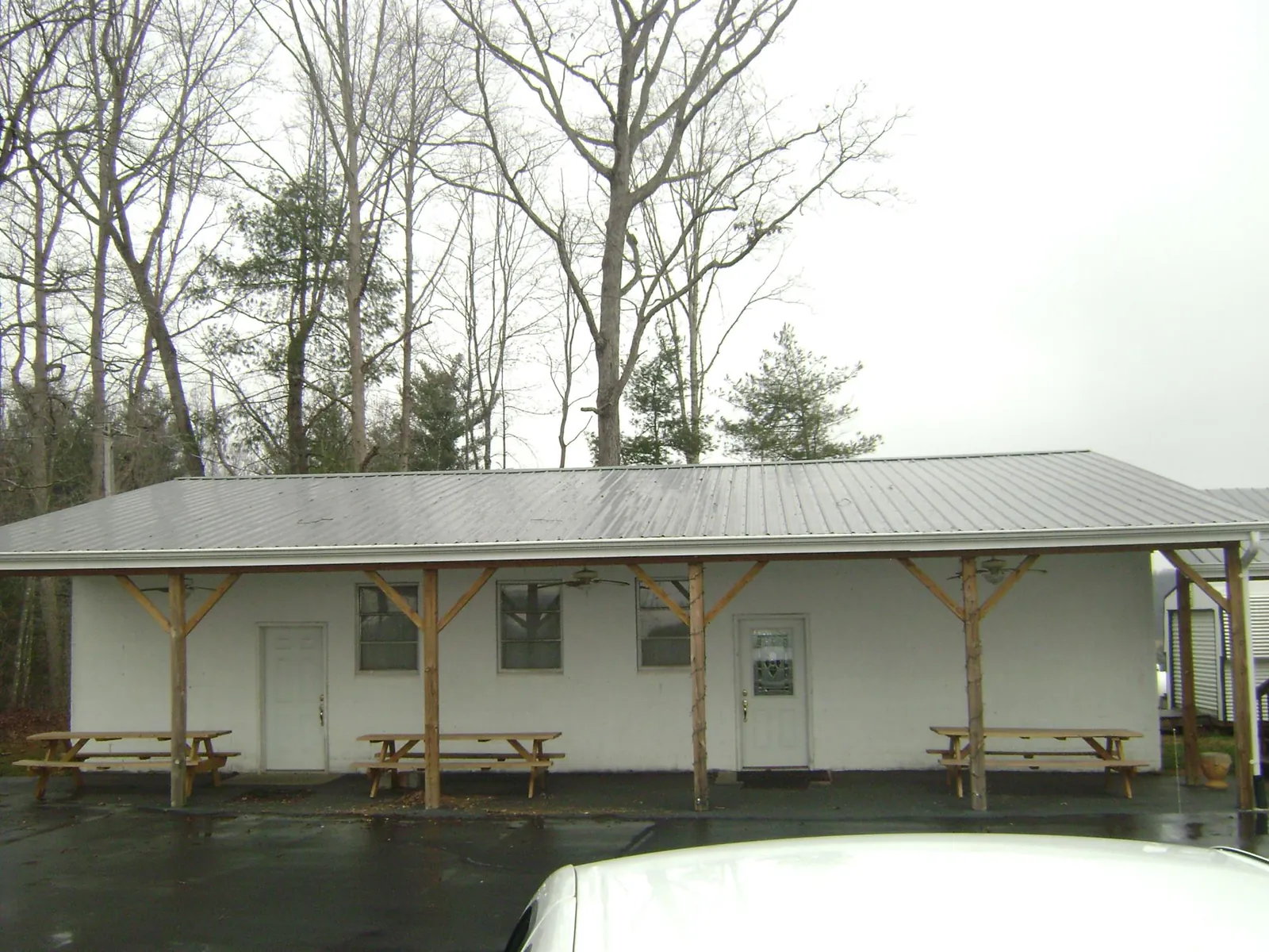 Gray metal roof over a block building with a timber post porch in Horseshoe Beach